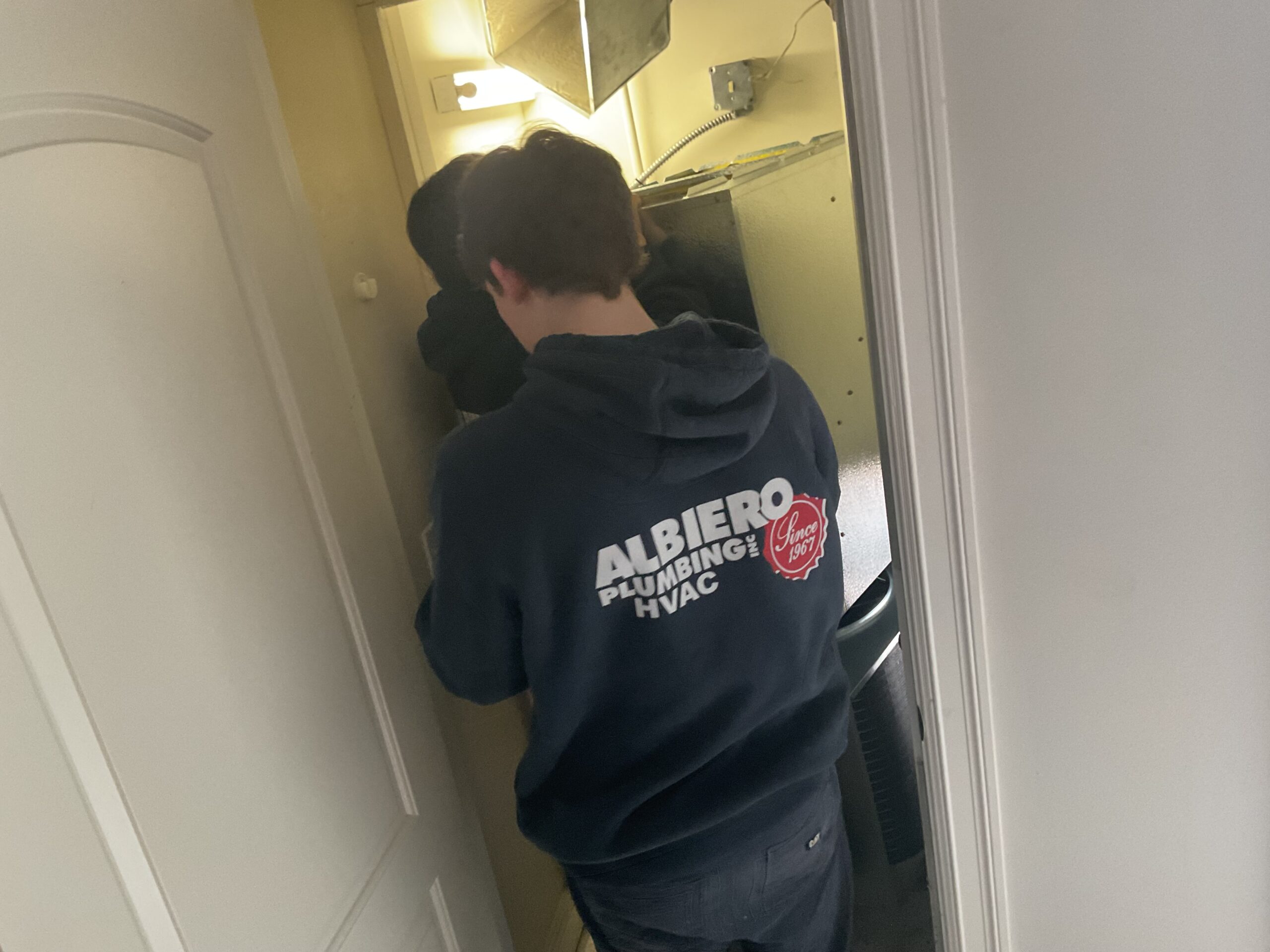 Albiero tech installing furnace in utility closet