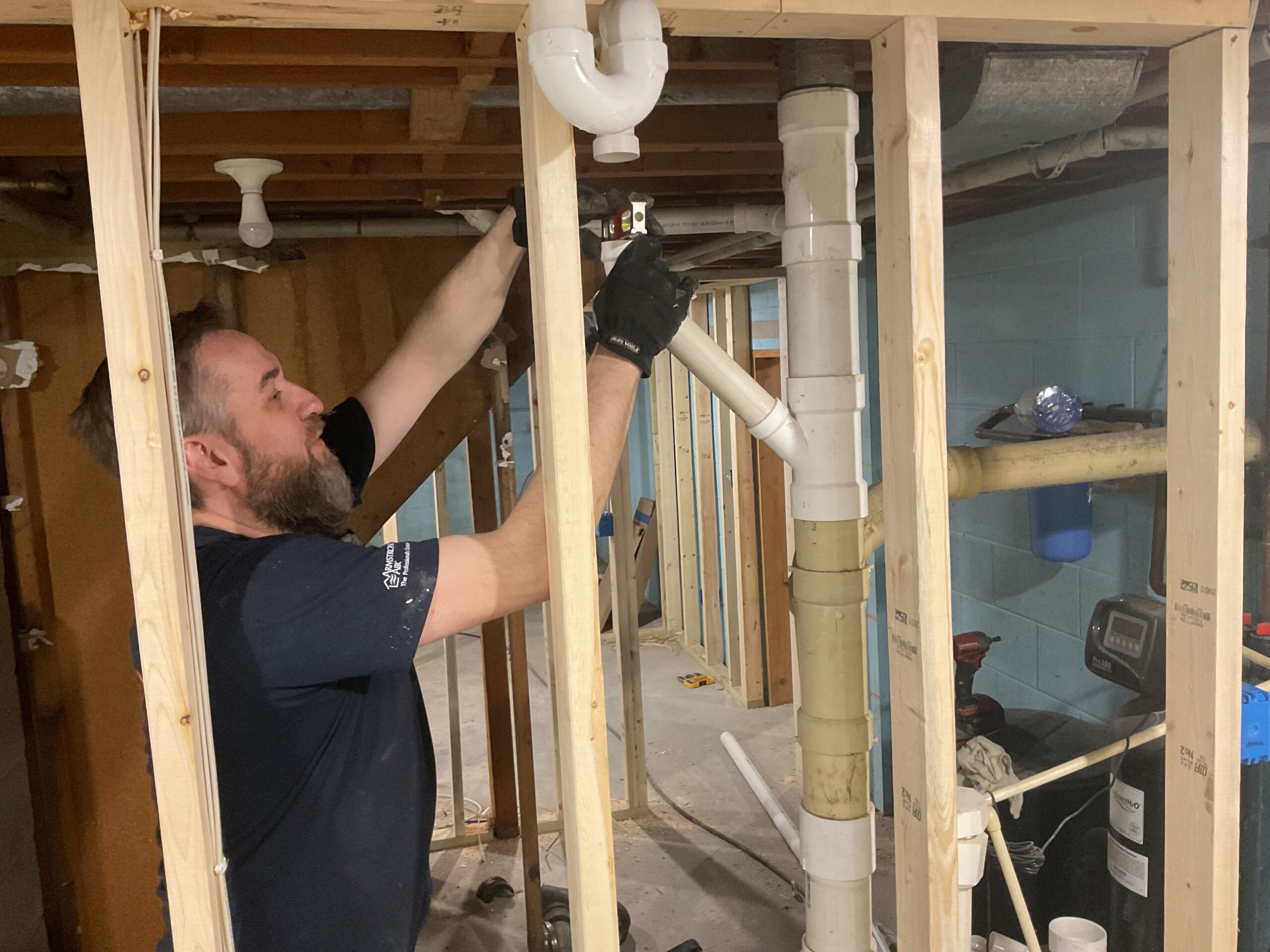 Albiero tech assembling pipe joints in basement