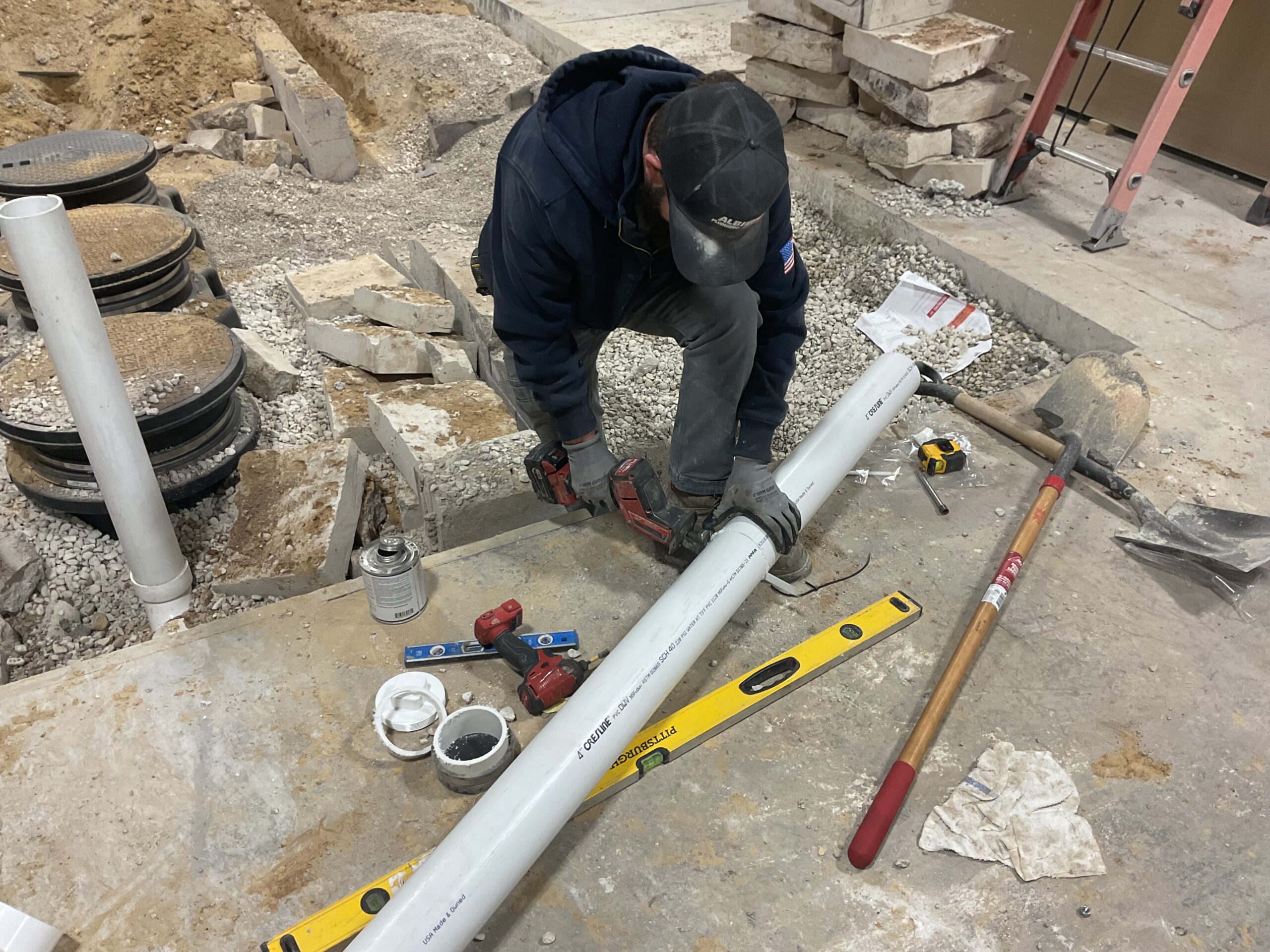 Albiero tech assembling sewer pipe with level